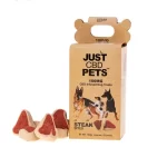 An open box of Just CBD of Pets Dog Treats with the steak bite flavor treats next to the box.